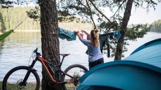Woman hanging up laundry at a camping