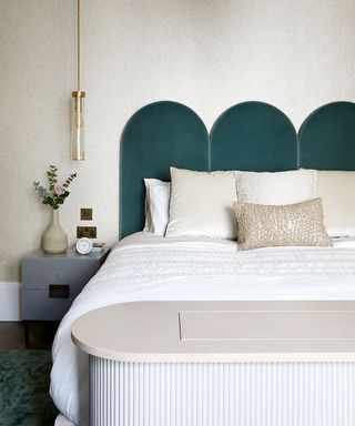 Mayfair apartment bedroom with green headboard