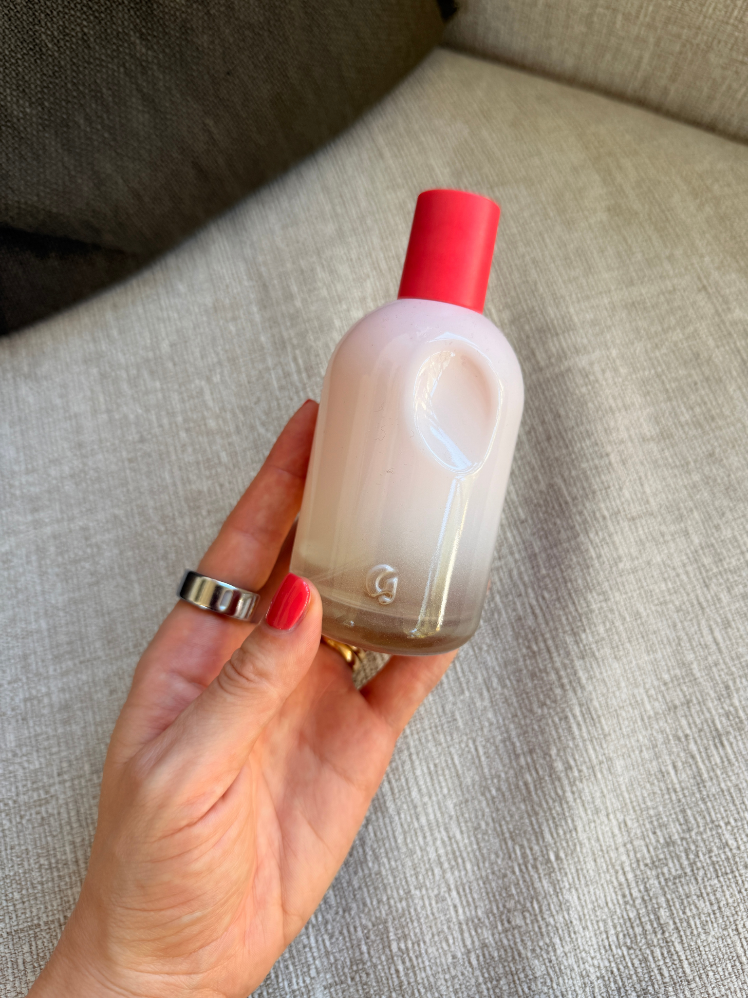 Grace Day holding the Glossier perfume