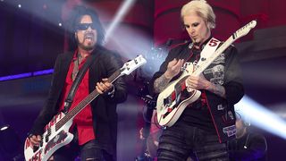 Mötley Crüe's Nikki Sixx (left) and John 5 onstage in Kansas