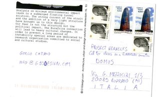 The back of a postcard with printed text, handwriting and stamps on it.