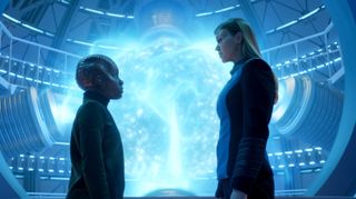Topa (Imani Pullum) and Cmdr. Kelly Grayson (Adrianne Palicki) in front of the quantum drive