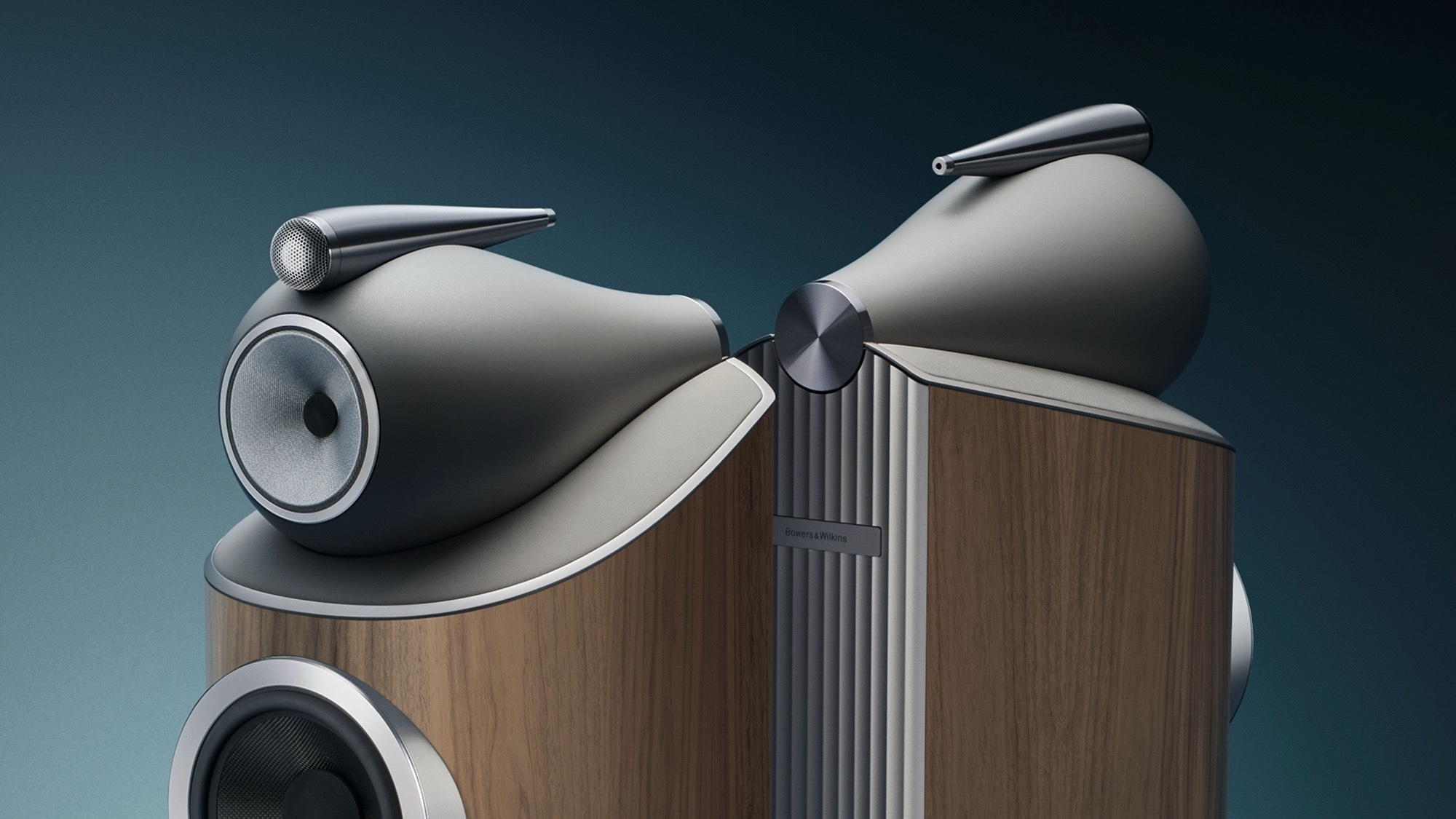 The tops of a pair of Bowers &amp; Wilkins 801 D5 speakers that are standing back to back.