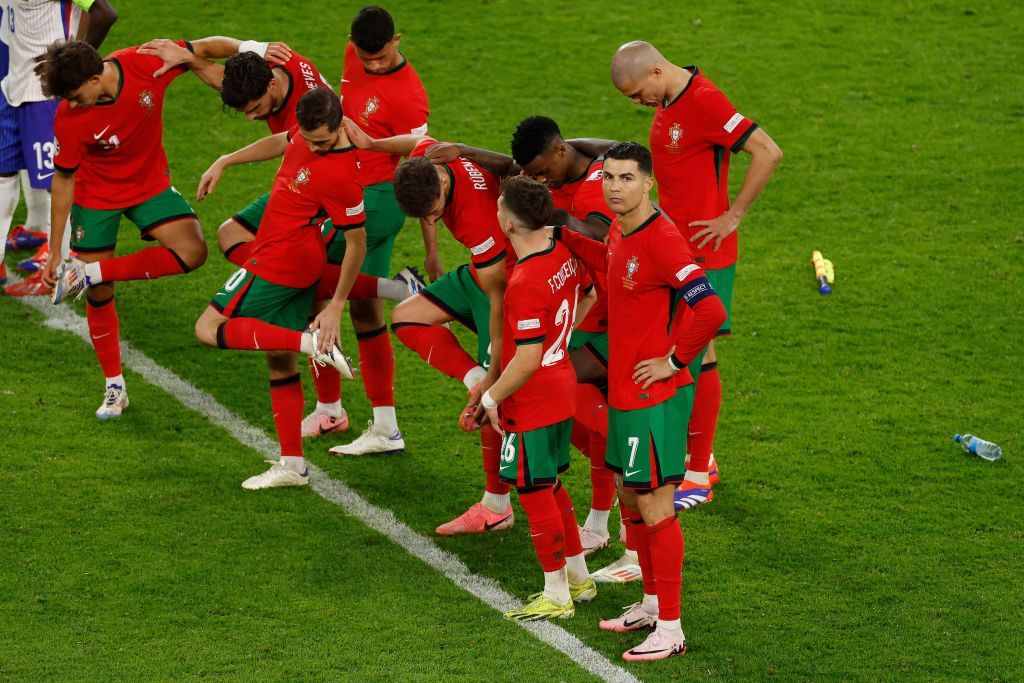 Portugal&#039;s forward #07 Cristiano Ronaldo and teammates react before a penalty shootout during the UEFA Euro 2024 quarter-final football match between Portugal and France at the Volksparkstadion in Hamburg on July 5, 2024