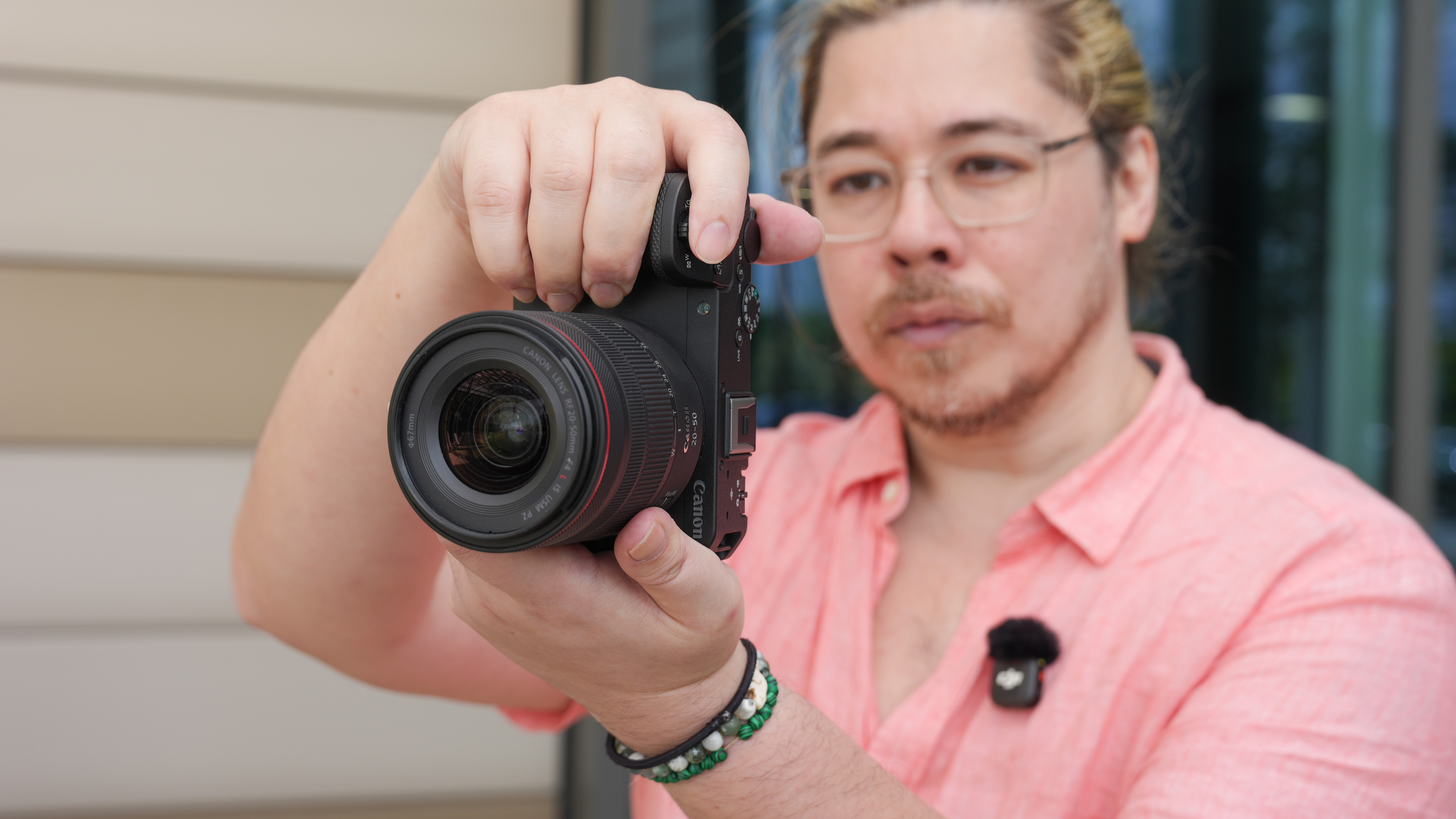 Canon EOS R6 V with the Canon RF 20-50mm f/4L IS USM PZ being held by James Artaius