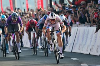 Soudal Quickâ€“Step's Belgian cyclist Tim Merlier (R) finishes to win the sixth stage the UAE Cycling Tour UCI 2025 in Abu Dhabi on February 22, 2025. (Photo by Giuseppe CACACE / AFP)