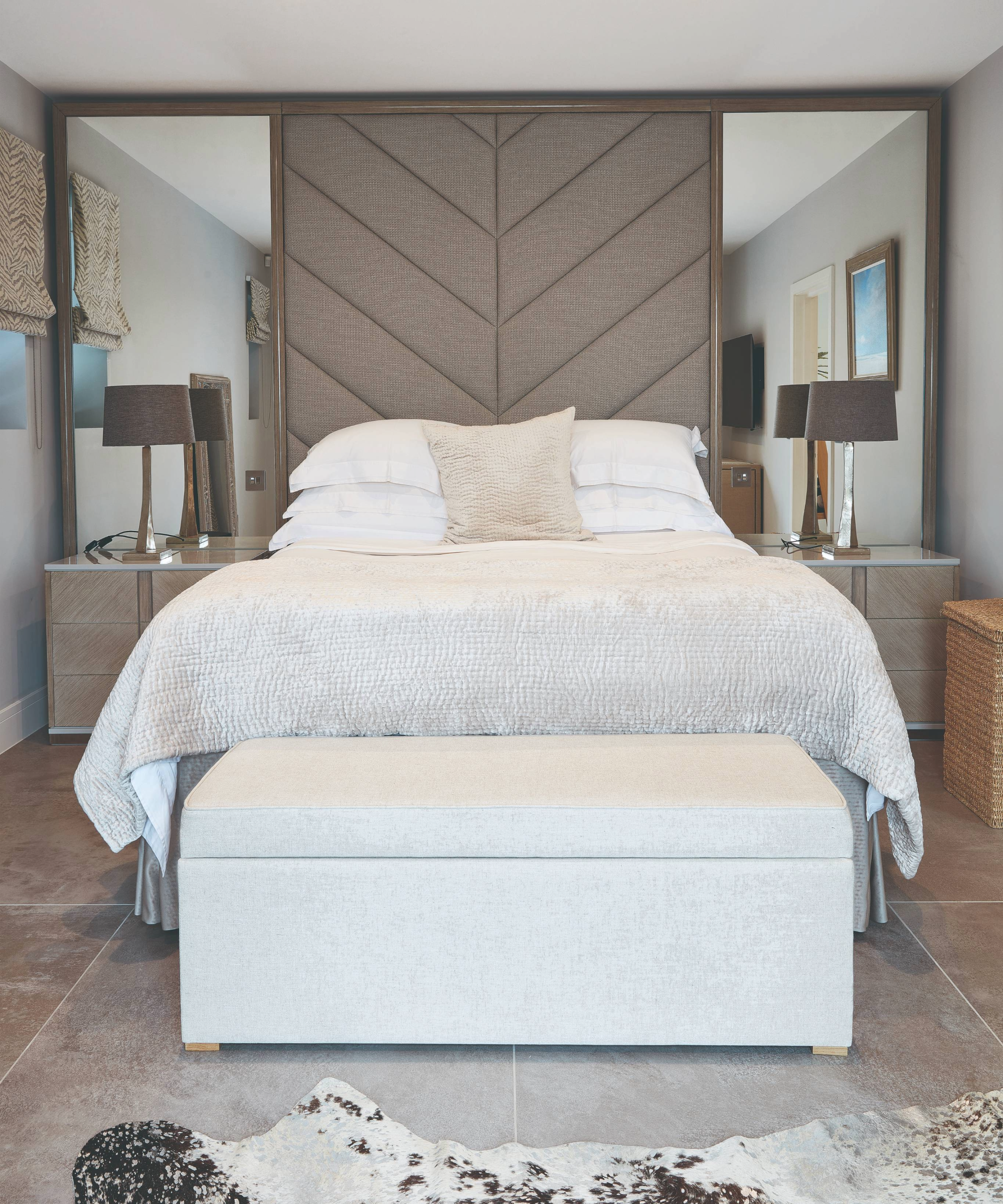 Headboard idea with cushioned panel and mirrors either side