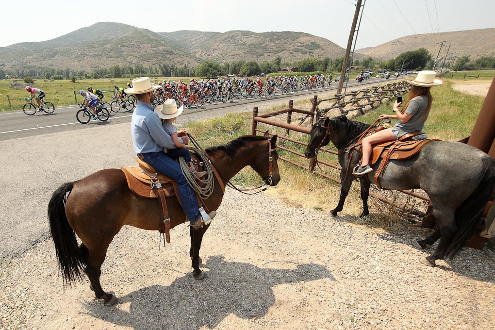 Equestrians watch the 2018 Tour of Utah pass by