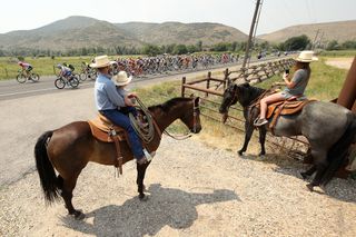 Equestrians watch the 2018 Tour of Utah pass by