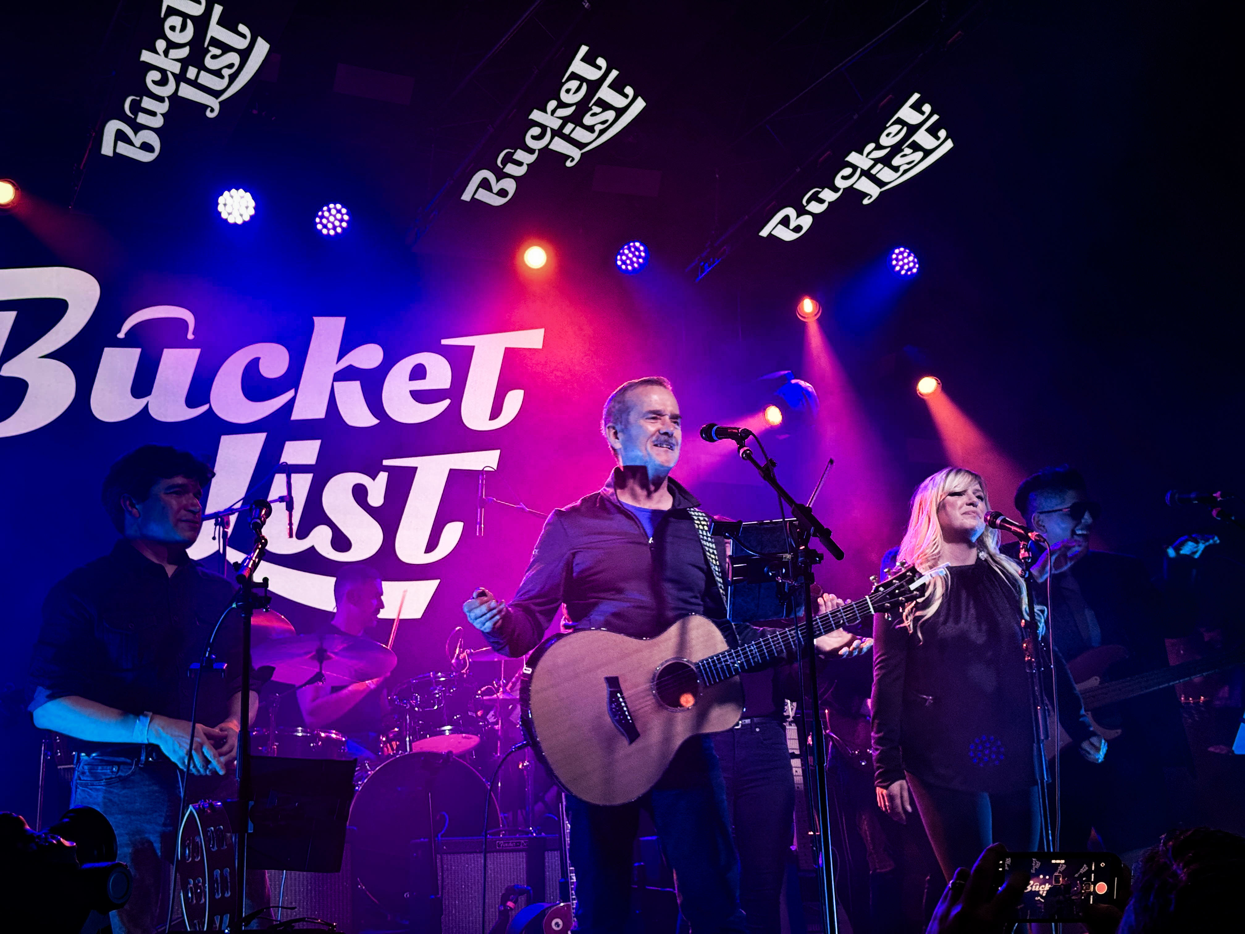 Chris Hadfield playing guitar along with the band Bucket List at a previous SickKids fundraiser