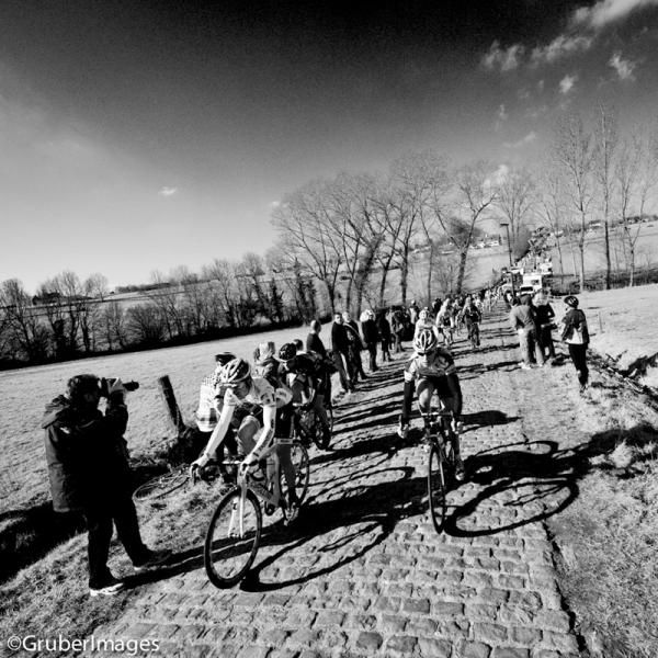 The men's field on the approach to another of the small Belgian climbs