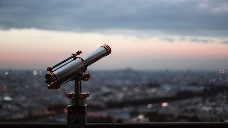 telescope on city balcony