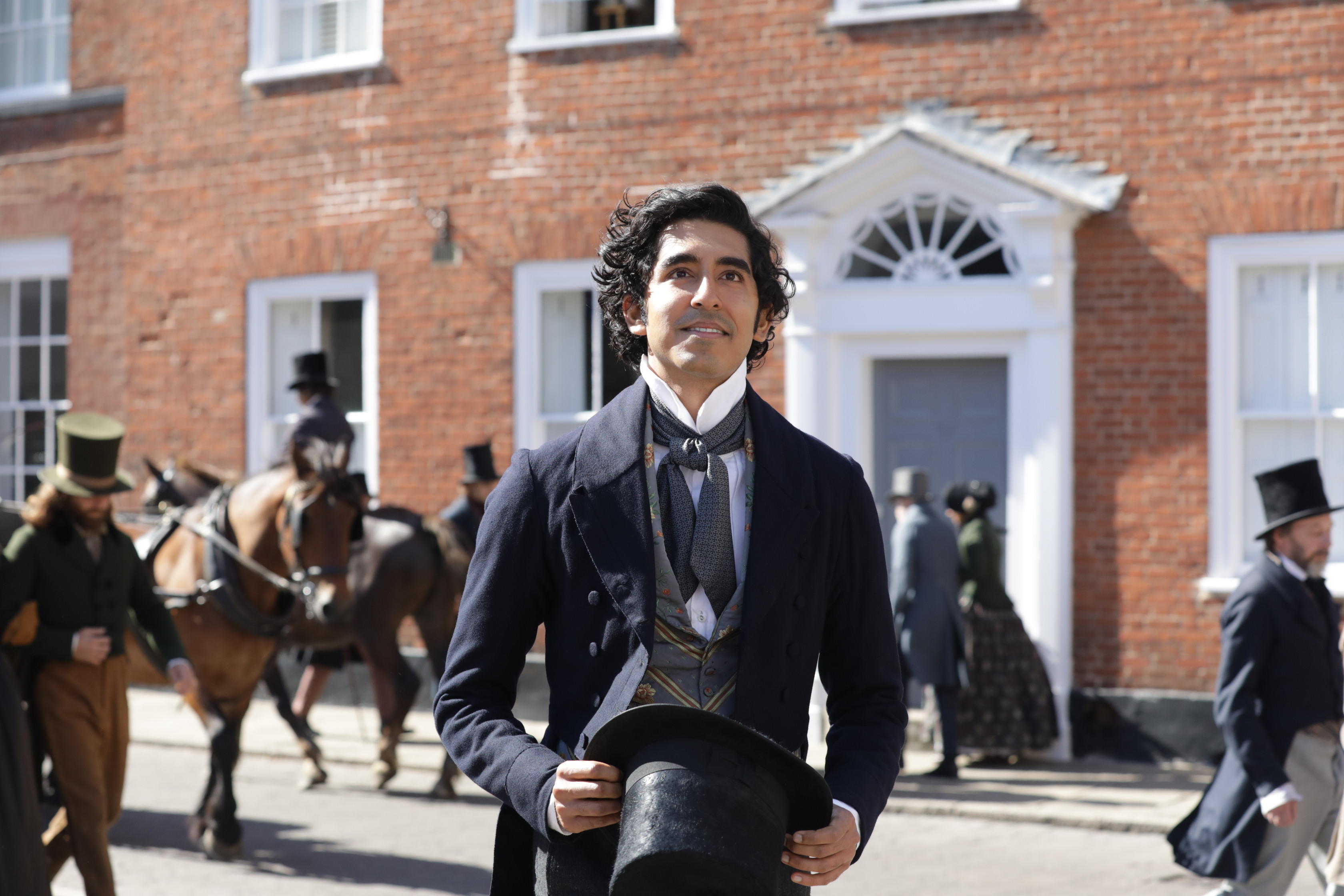 Actor Dev Patel in Victorian dress, in a film still for David Copperfield (2019)