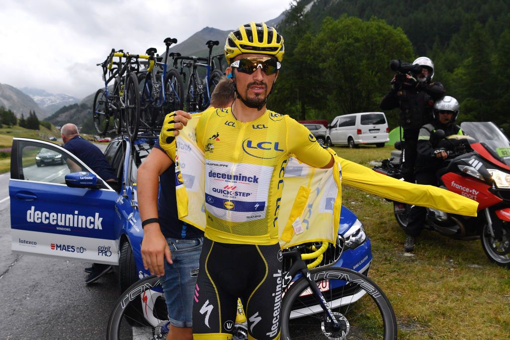Julian Alaphilippe (Deceuninck-QuickStep) pulls on a cape after the stage was truncated before the finish