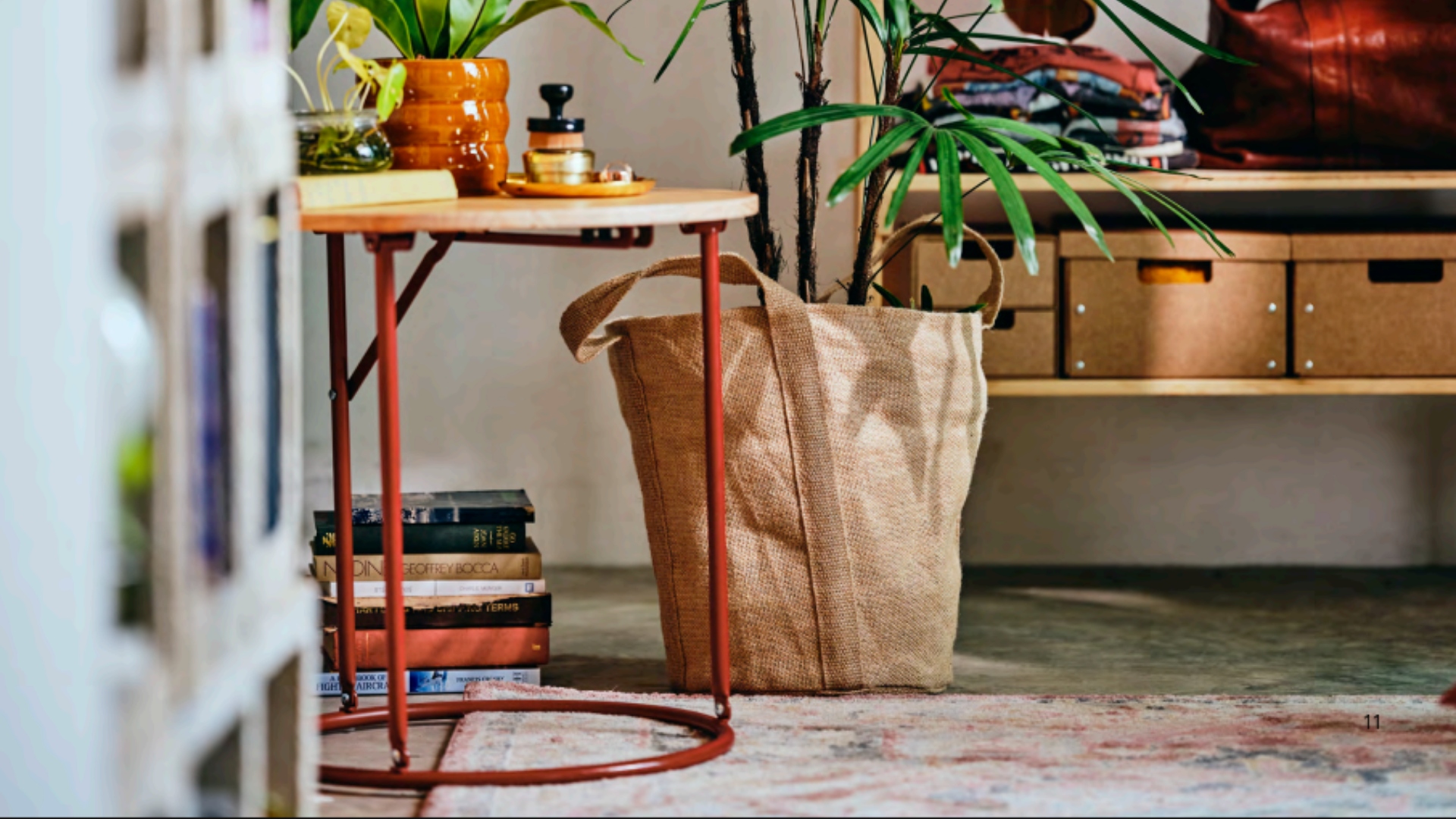 An IKEA side table and jute plant pot in a room