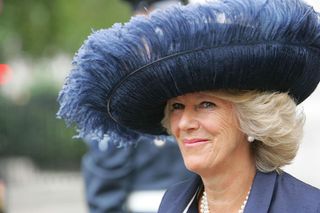 Queen Camilla sporting a huge navy feathered hat in 2005