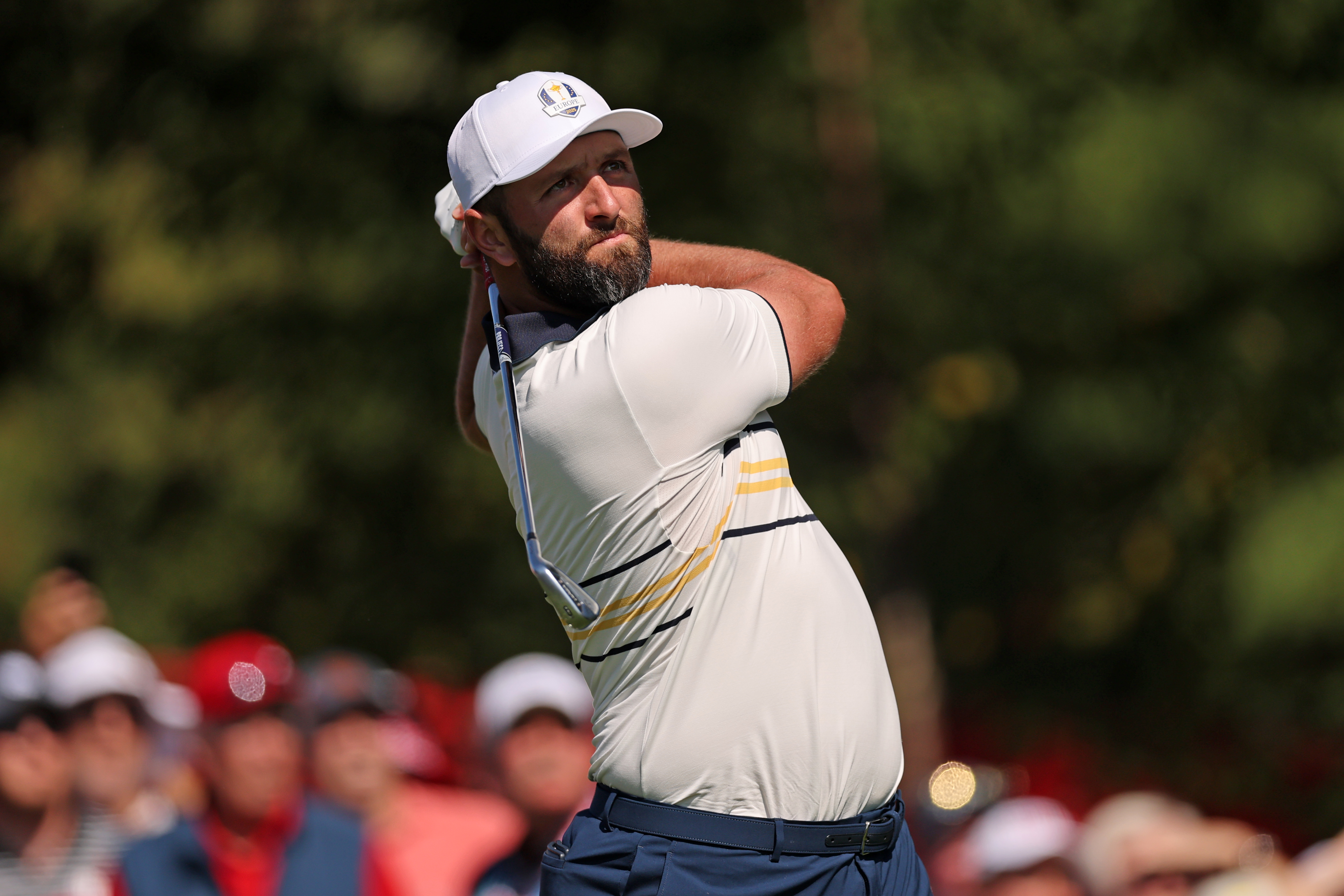 Jon Rahm hits an iron shot