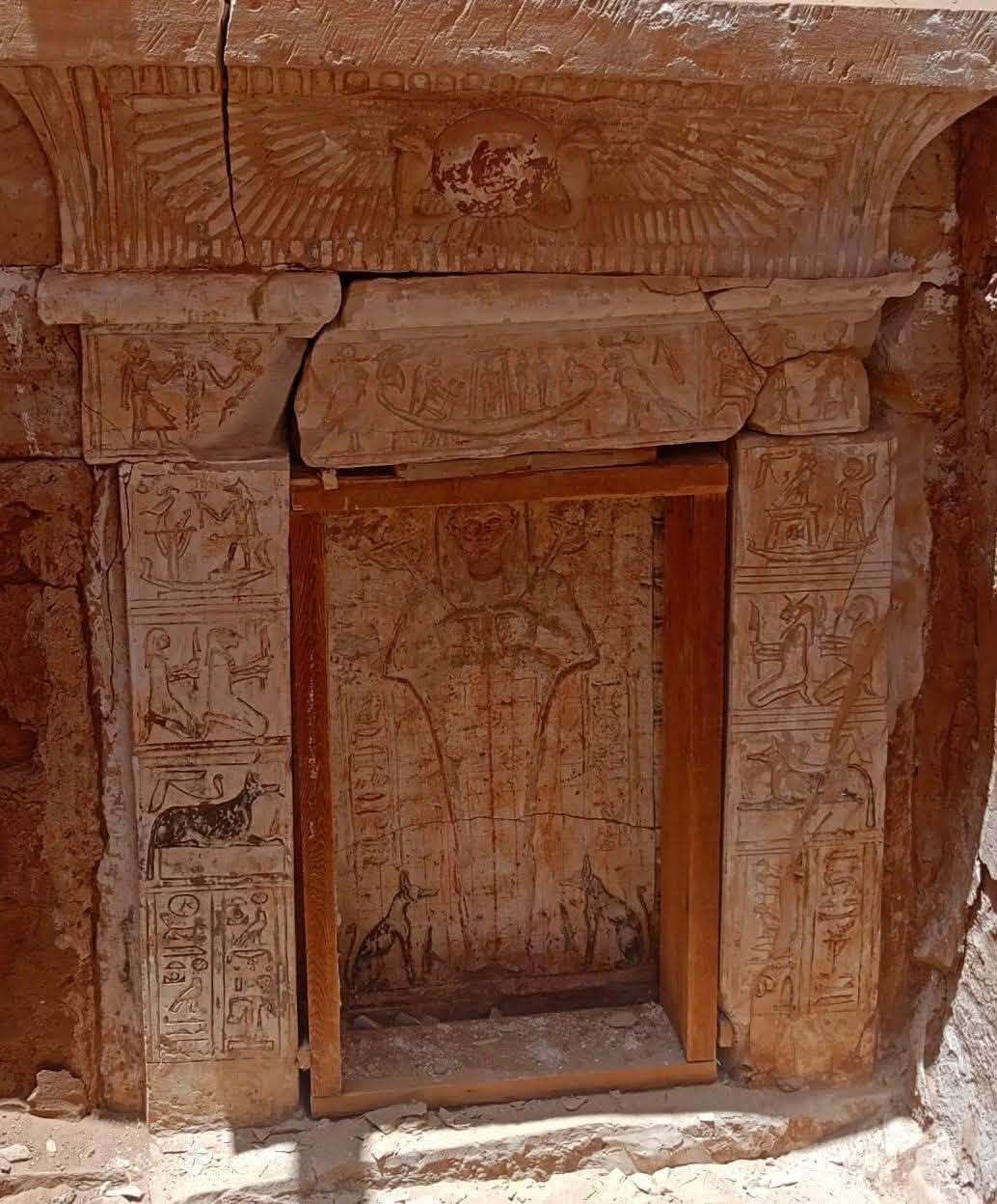 Close up of a vertical doorway in a rock wall.