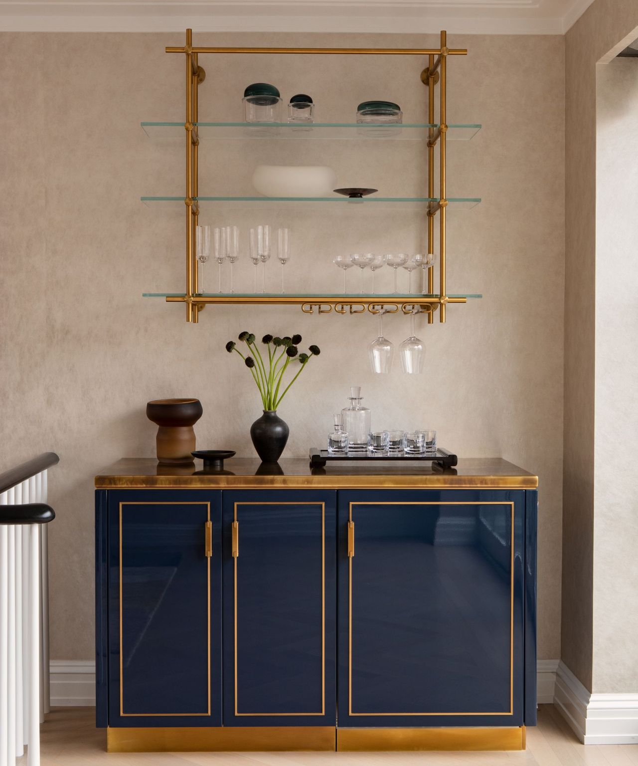 A navy blue and gold home bar