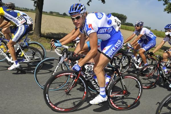 Wouter Weylandt (Quick Step) is loaded up with bottles for his teammates.