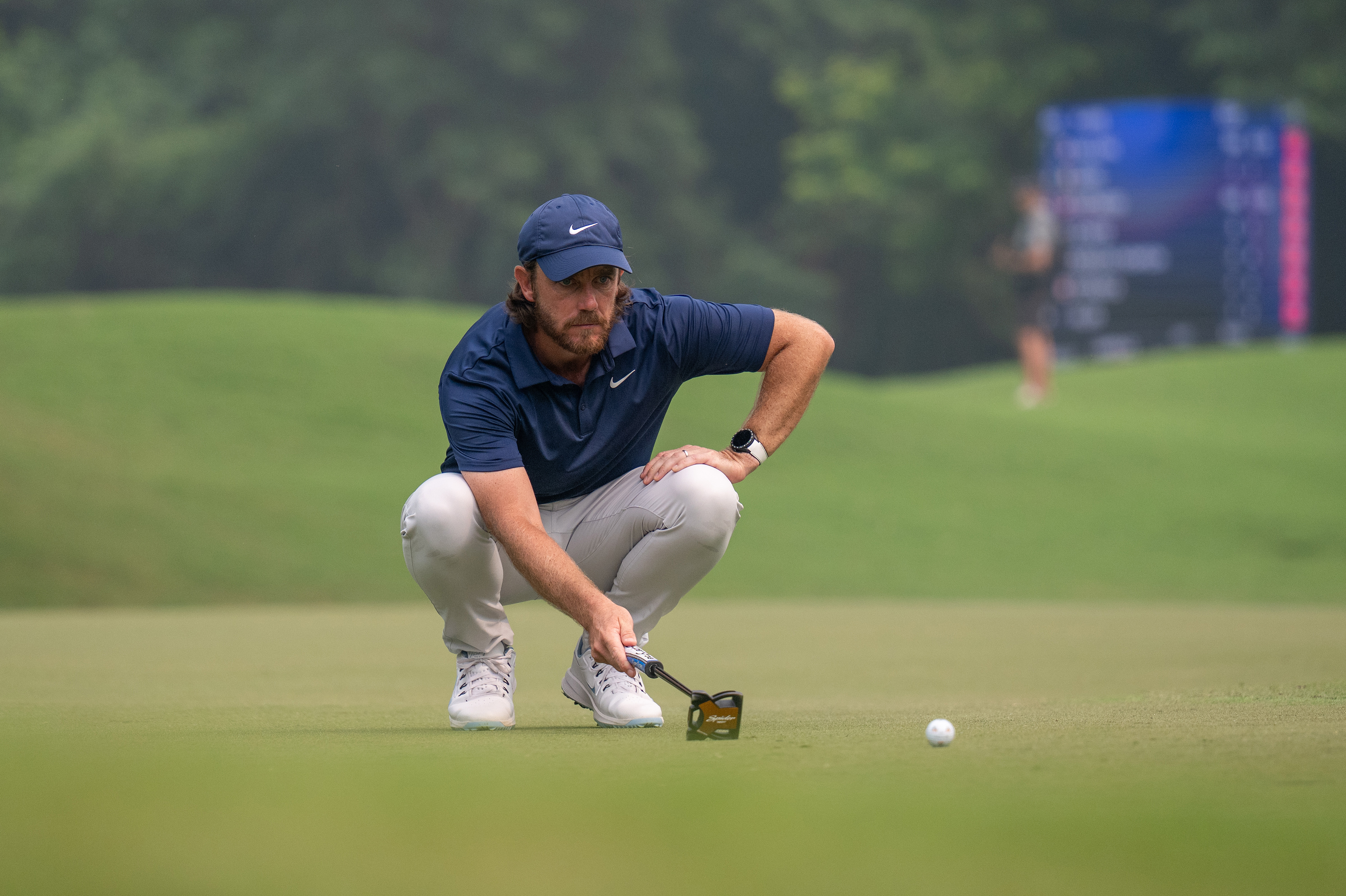 Tommy Fleetwood lines up a putt