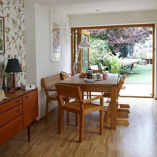dining area with wooden dining table chairs and wooden floor