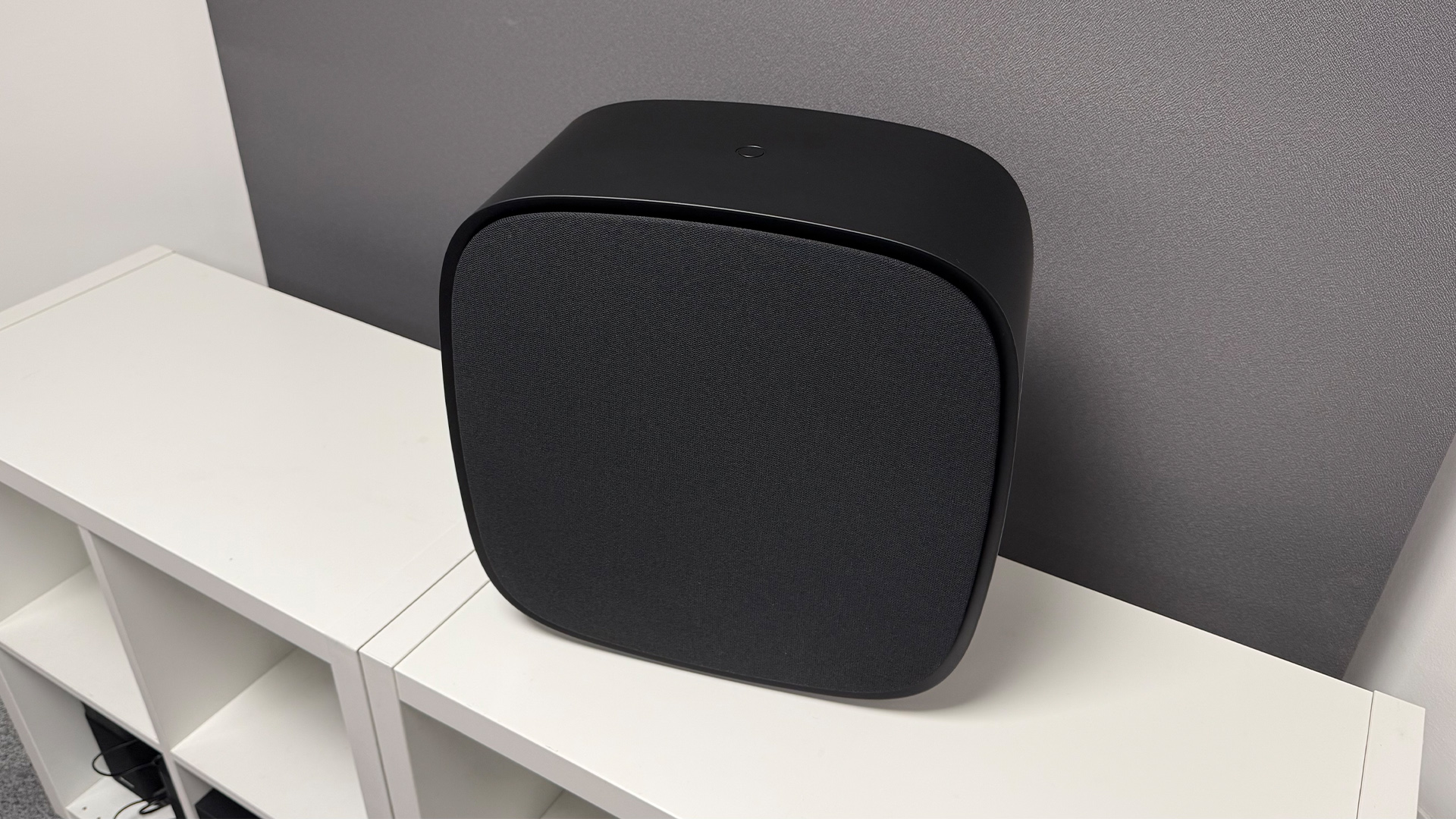 LG Sound Suite system soundbar system subwoofer on white shelving unit