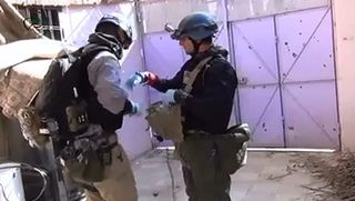 UN inspectors collecting samples from a site that was allegedly hit by a chemical gas weapon, in Moadamiyeh suburb, Damascus, Syria.