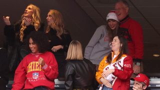 Brittany Mahomes looks on while Taylor Swift hugs Scott Kingsley Swift and Alana Haim cheers while the Kansas City Chiefs and the New England Patriots play at Gillette Stadium on December 17, 2023 in Foxborough, Massachusetts.