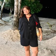 Woman wears linen shorts and linen shirt