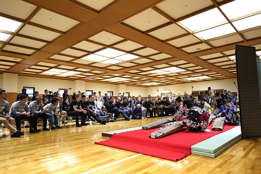 Riders and media are treated to a traditional Japanese harp performance