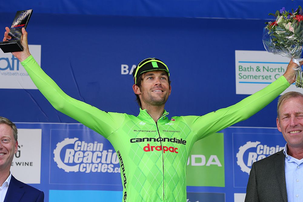Jack Bauer celebrates his stage 5 win on the podium at the Tour of Britain.