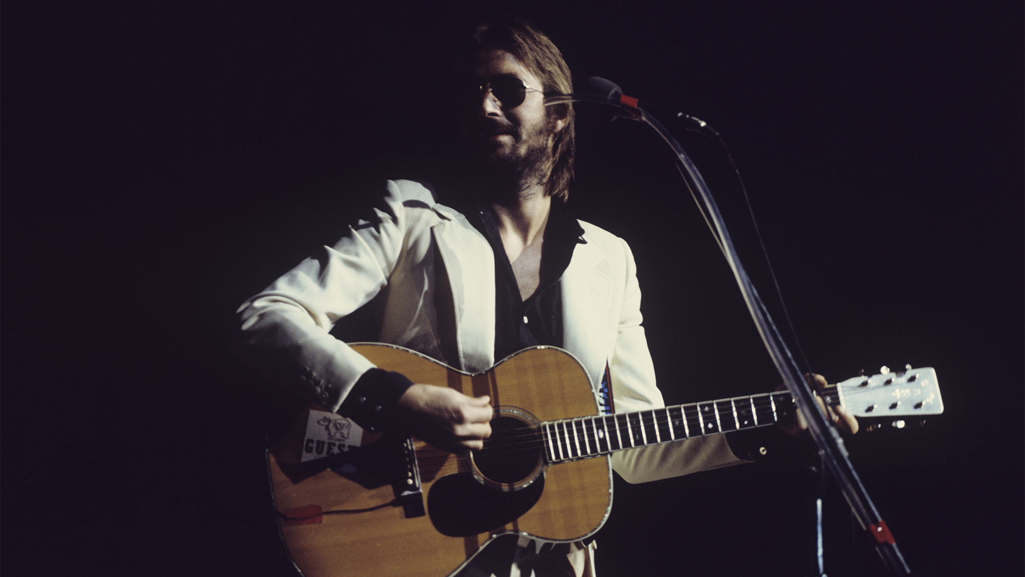 Eric Clapton performs on stage in July 1974.