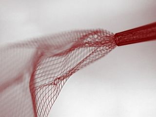 This nanoscale electronic mesh can be injected into brain tissue through a needle.