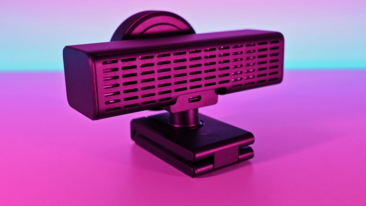 Rear profile of the Razer Kiyo V2 Pro webcam showing the back ventilation grille and USB-C port in pink light.
