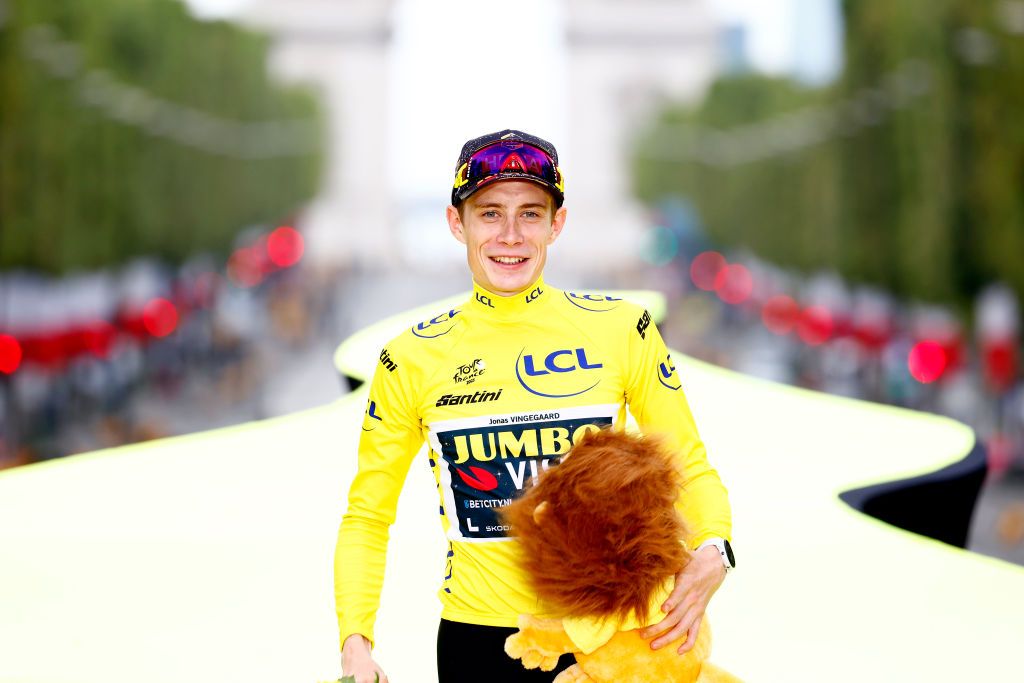 A smiling Jonas Vingegaard (Jumbo-Visma) celebrates his back-to-back overall victory at the Tour de France