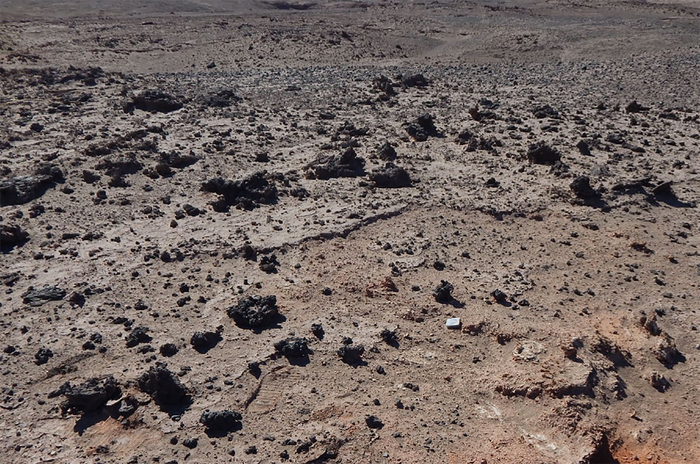 Dark silicate glass is seen against the Atacama Desert in northern Chile.