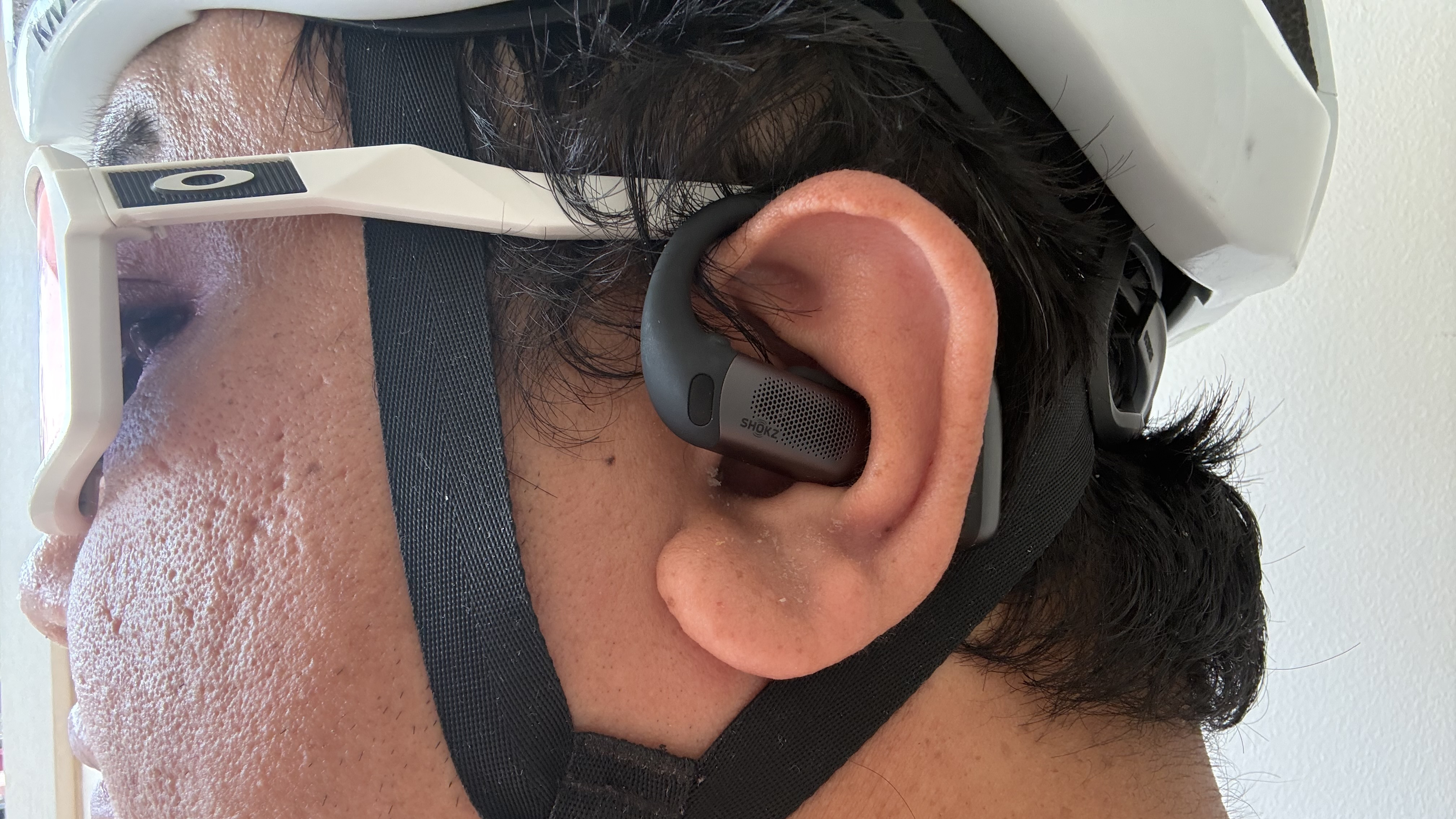 Author Nico Arboleda wearing the Shokz OpenFit Pro for a bike ride