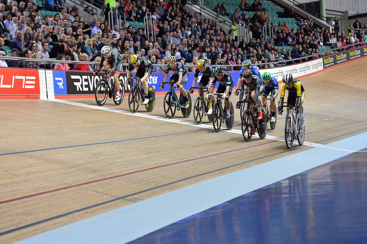 The riders cross the line
