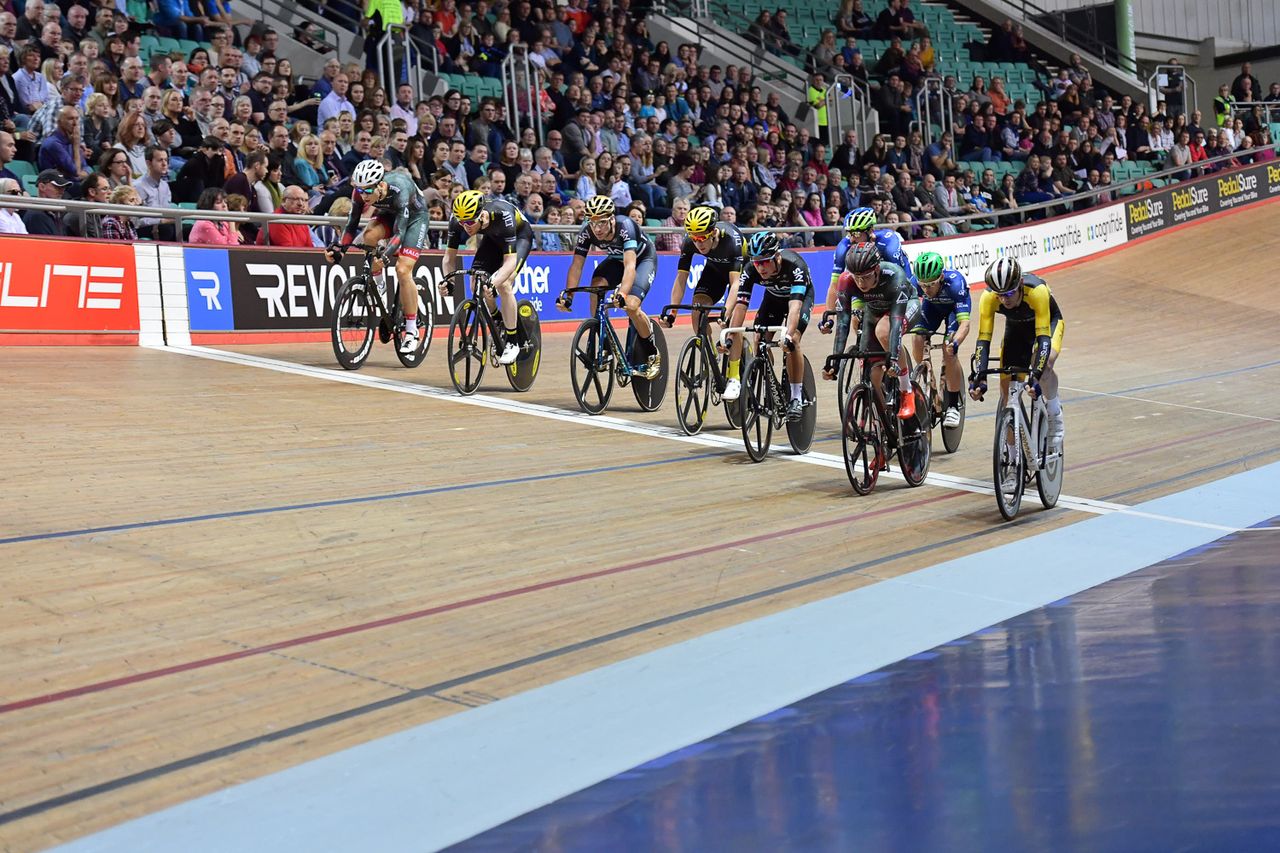 The riders cross the line