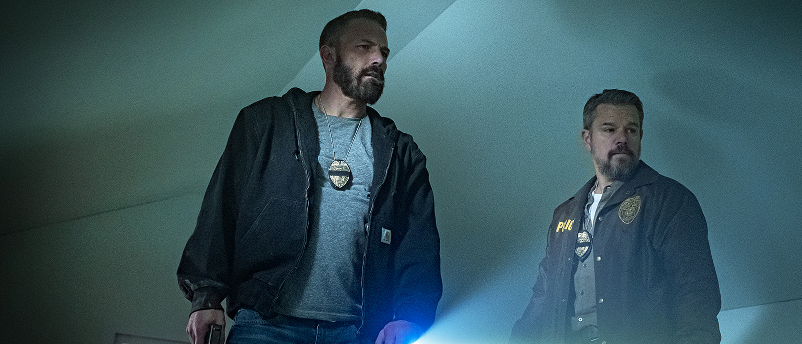 J.D. and Dane inspecting the attic of a house in Netflix crime thriller The RIP