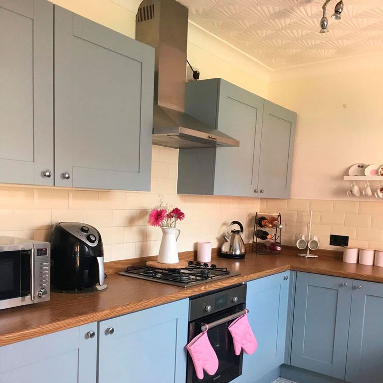 Before and after grey kitchen with DIY Fablon worktops and stencilled