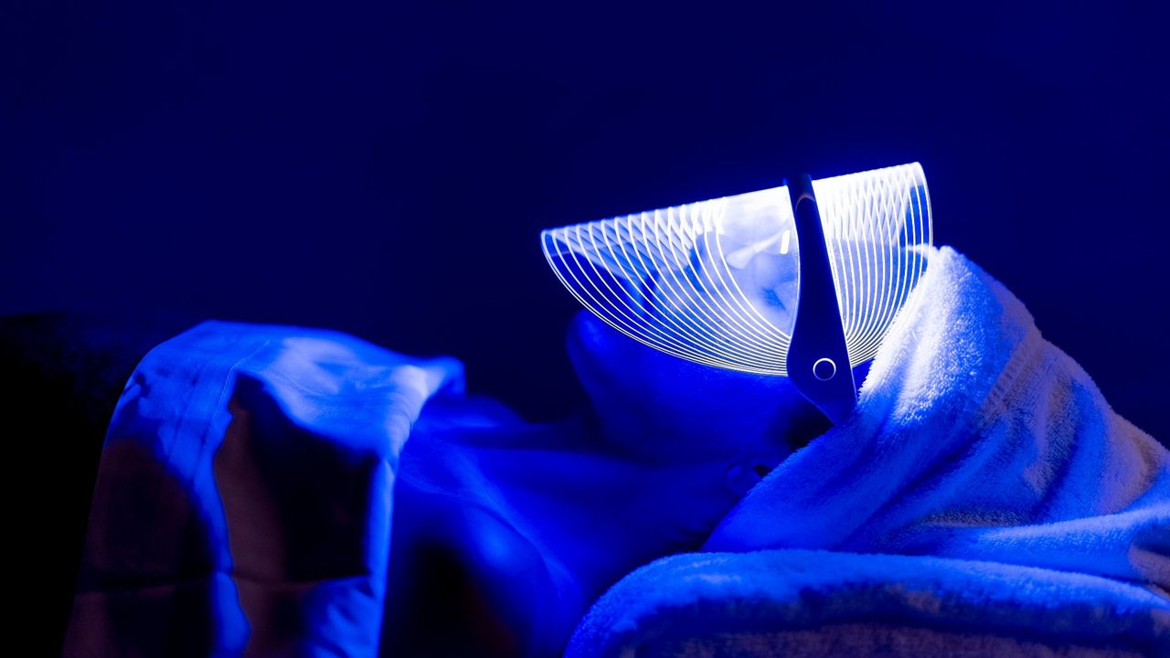 women using blue led light therapy for acne