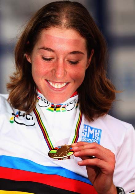 Nicole Cooke inspects her medal after winning in 2008