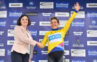 Alison Jackson of TIBCO-Silicon Valley Bank cycling team on the podium in the yellow Baillie Gifford Leader's Jersey after winning stage 2.