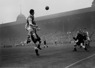 Arsenal's Doug Lishman heads at goal in the 1952 FA Cup final against Newcastle United at Wembley.