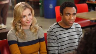 Gillian Jacobs' Britta and Donald Glover's Troy sitting next to each other in Community