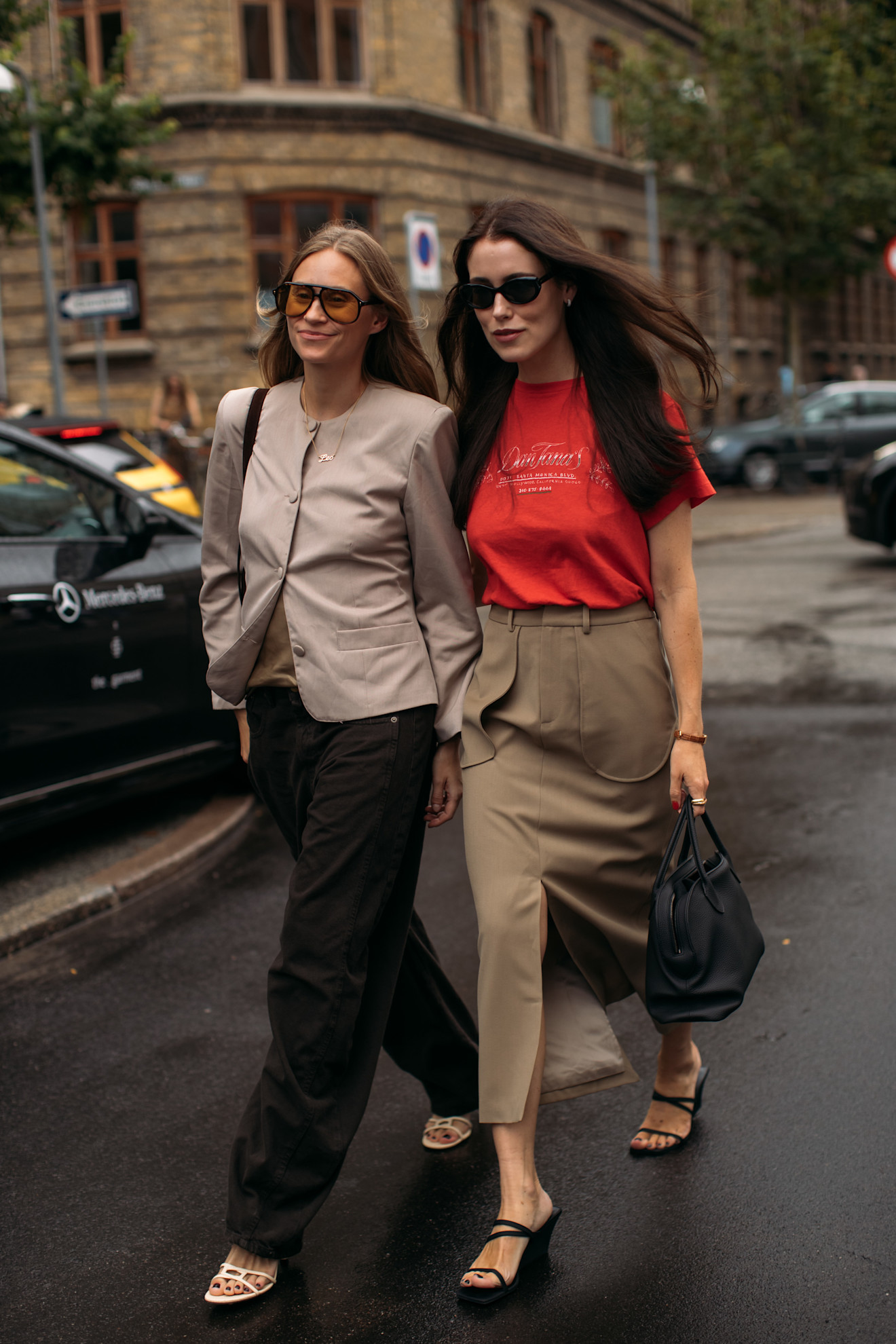 guests at Copenhagen Fashion Week style flip flops with pants, suits, and barn jackets