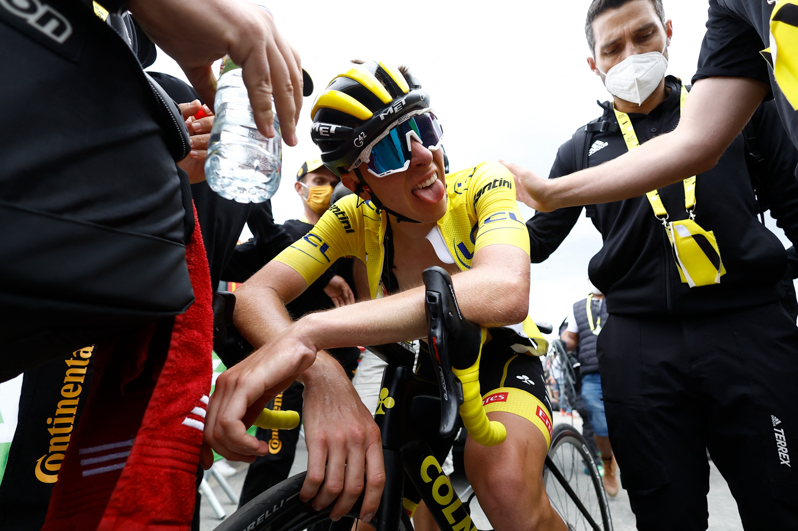 Tadej Pogacar sticking his tongue out at the summit of the Col du Granon