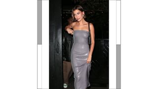 Hailey Bieber is seen wearing a silver strapless dress, leaving Rhode launch party at Chiltern Firehouse on May 17, 2023 in London, England.